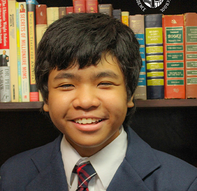 Young male student in suit